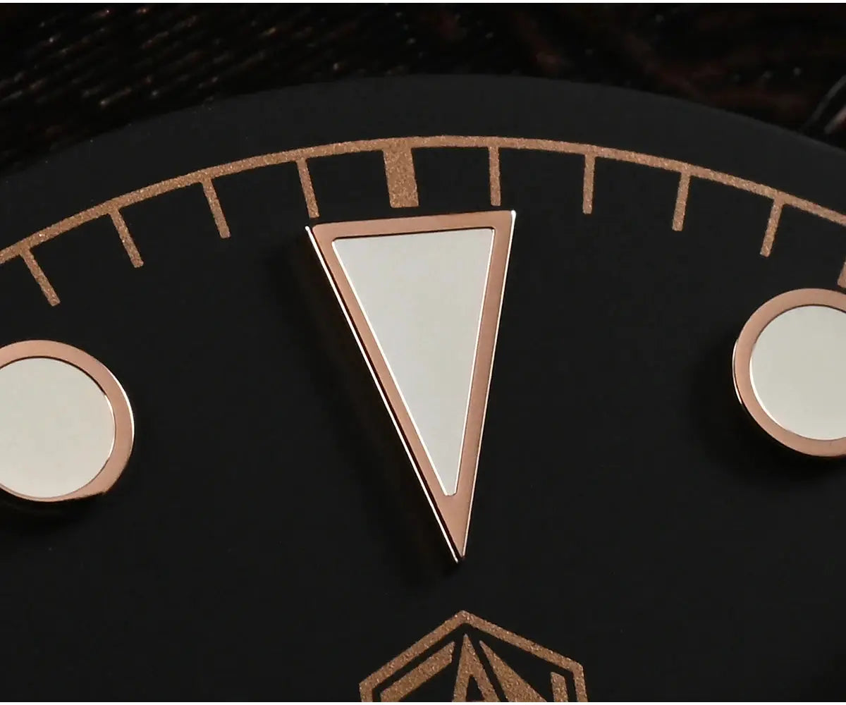 San Martin BB Diver watch dial close-up with rose-gold triangle marker and two circular markers on black background