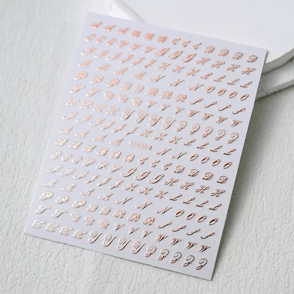 3D Roman letter nail stickers sheet in rose-gold metallic, self-adhesive decals for manicures