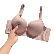 Pink nude push-up bra for small chests with thick padded cups, ribbed fabric, and wide straps