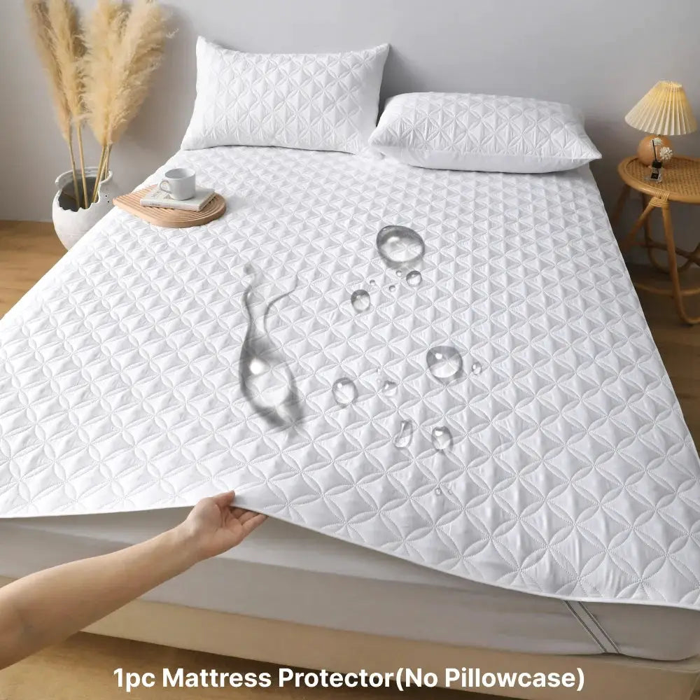 White waterproof mattress protector with elastic band; breathable quilted bed pad