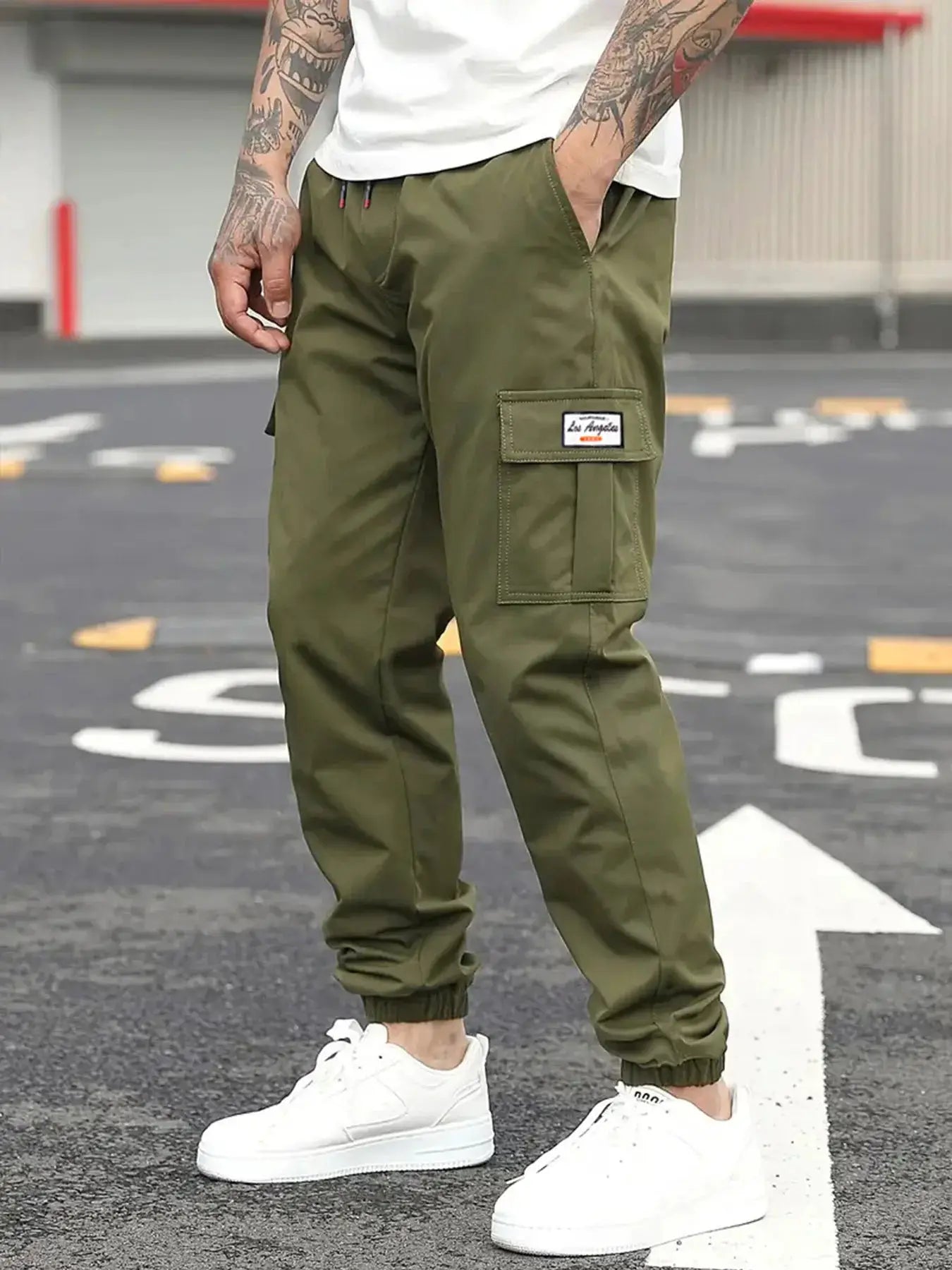 Spring men's casual cargo jogger pants olive green with elastic waist drawstring and cargo pocket.