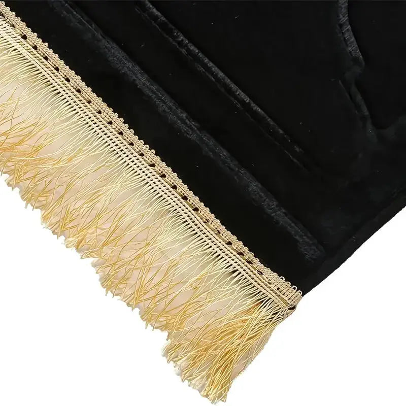Thick black prayer rug with cream tassel fringe on soft flannel, anti-slip mat