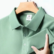 Men's green solid polo shirt, short-sleeved, on hanger