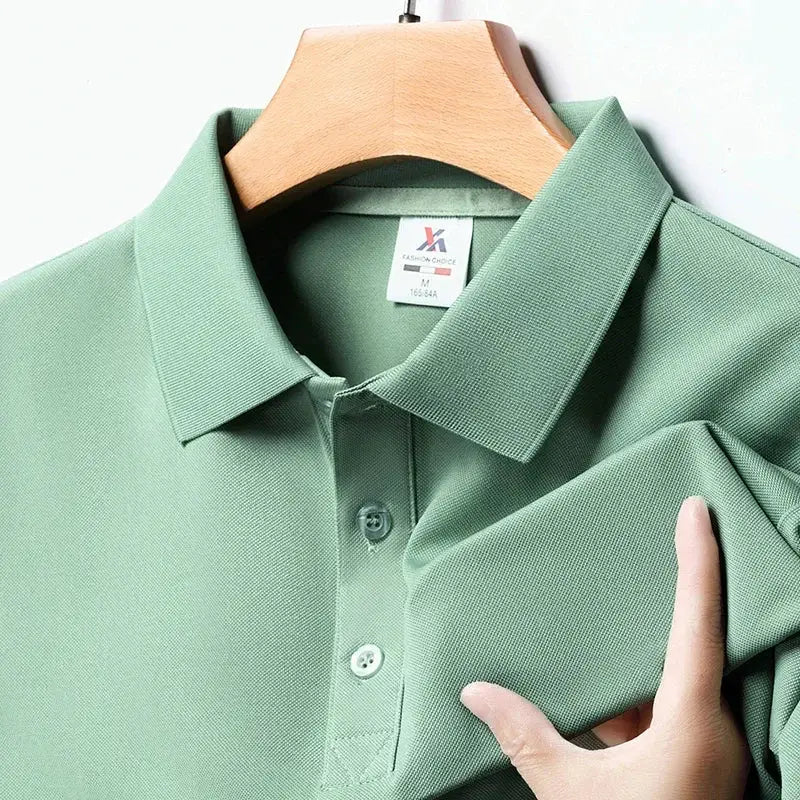 Men's green solid polo shirt, short-sleeved, on hanger