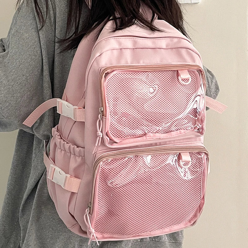 Pink Japanese-style transparent ita backpack with two mesh front pockets by Simples Market