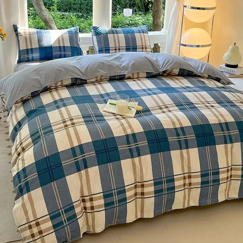 Blue plaid duvet cover bedding set with matching pillowcases on a bed