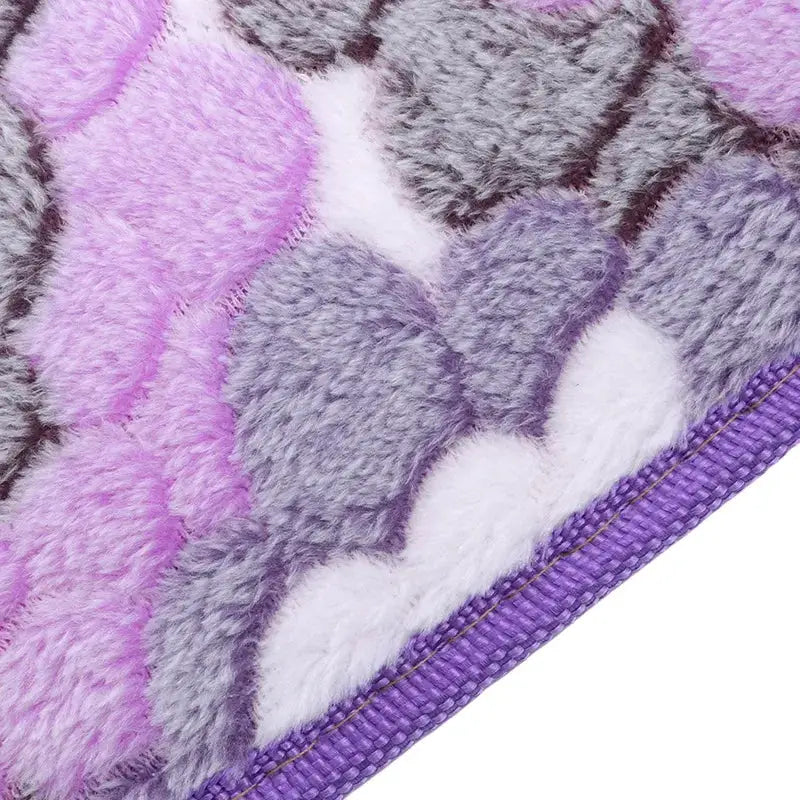 Plush toilet seat cover and bathroom mat in purple lavender white with a purple edge