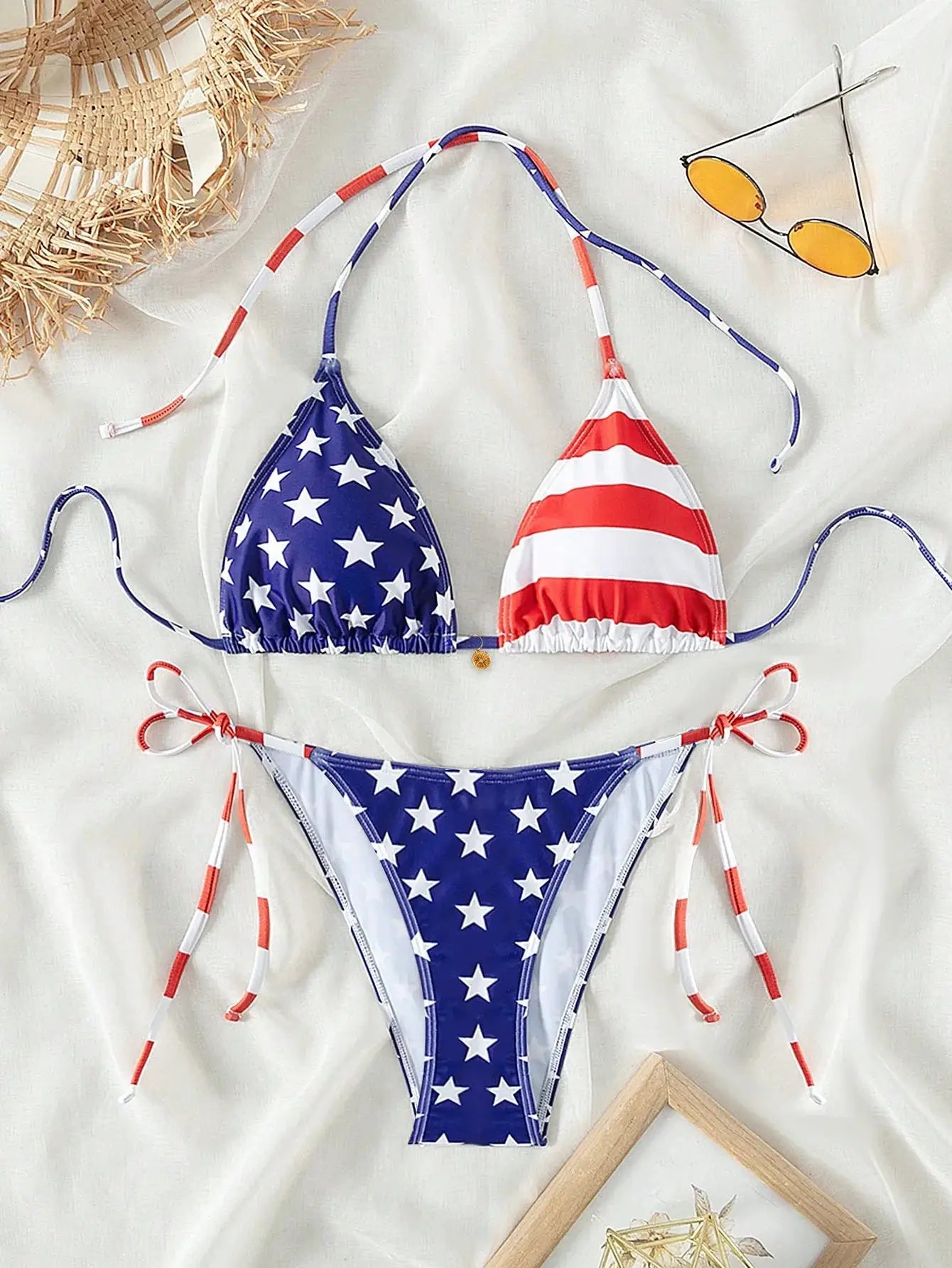Bikini set by Simples Market; star-print blue top and red-white striped top with adjustable ties, star-pattern bottom.