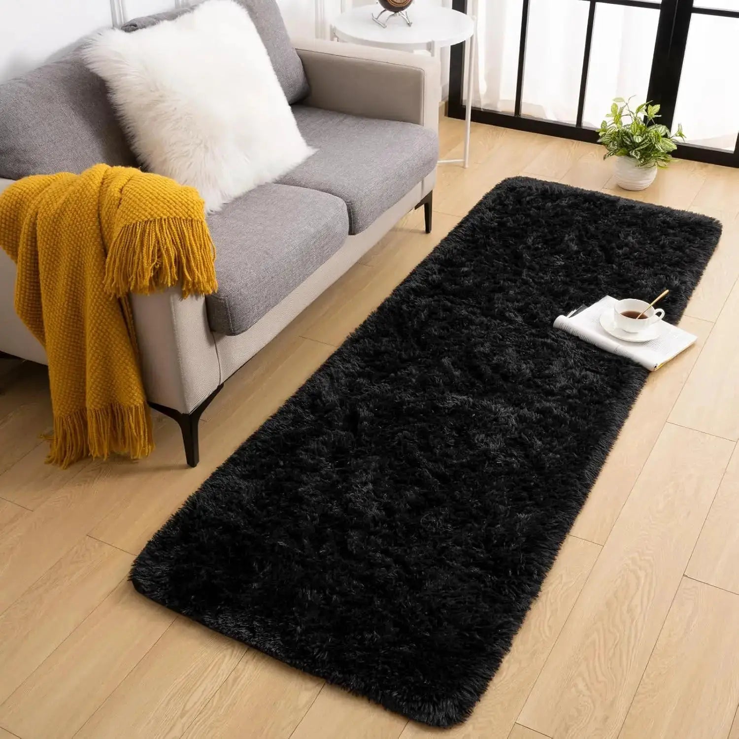 VIKAMA black shaggy large area rug for living room beside gray sofa with mustard throw