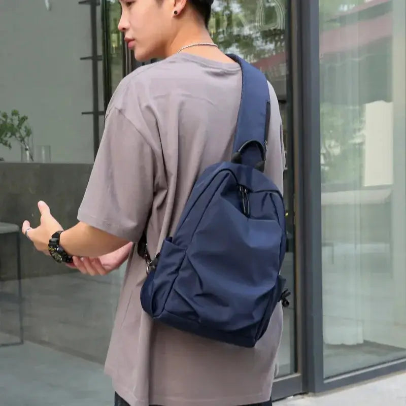 Men's navy canvas crossbody chest bag with adjustable strap by Simples Market