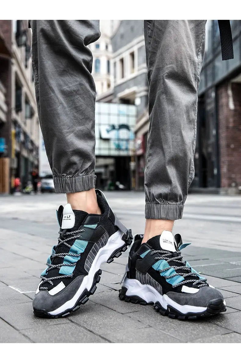 Simples Market men's sneakers in black with teal accents and a chunky sole.