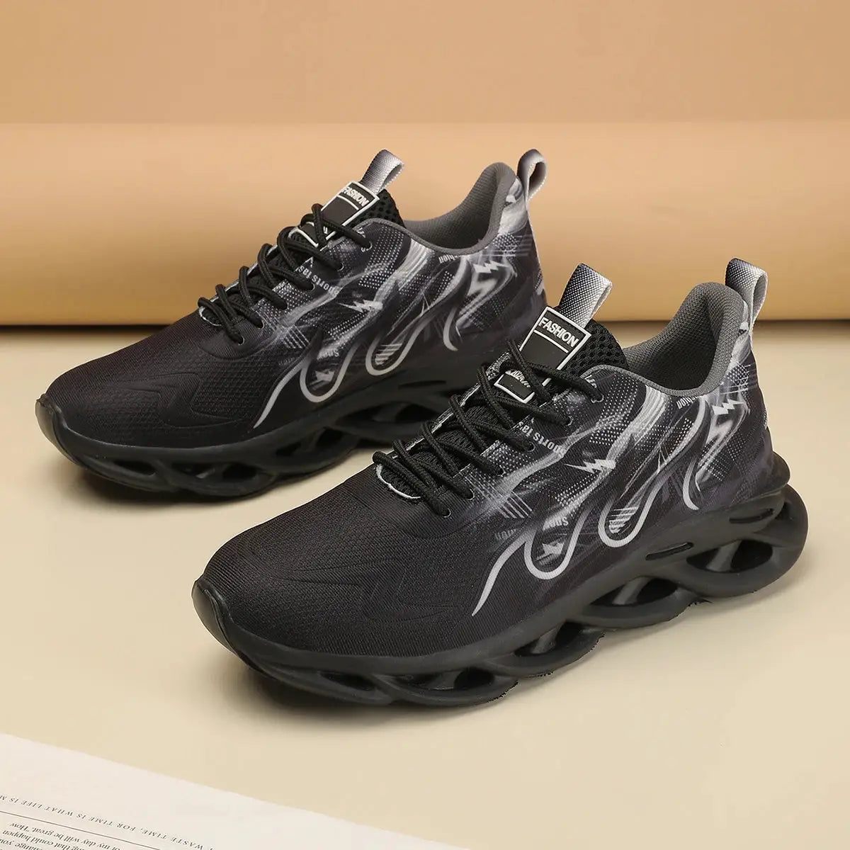 Unisex black running shoes with breathable mesh upper, gray graphic pattern, lace-up design and chunky hollow sole.