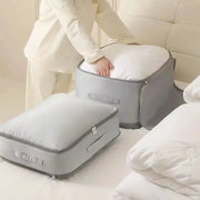 Two gray Simples Market heavy-duty self-compressing storage bags with handles and zippers for clothes and blankets