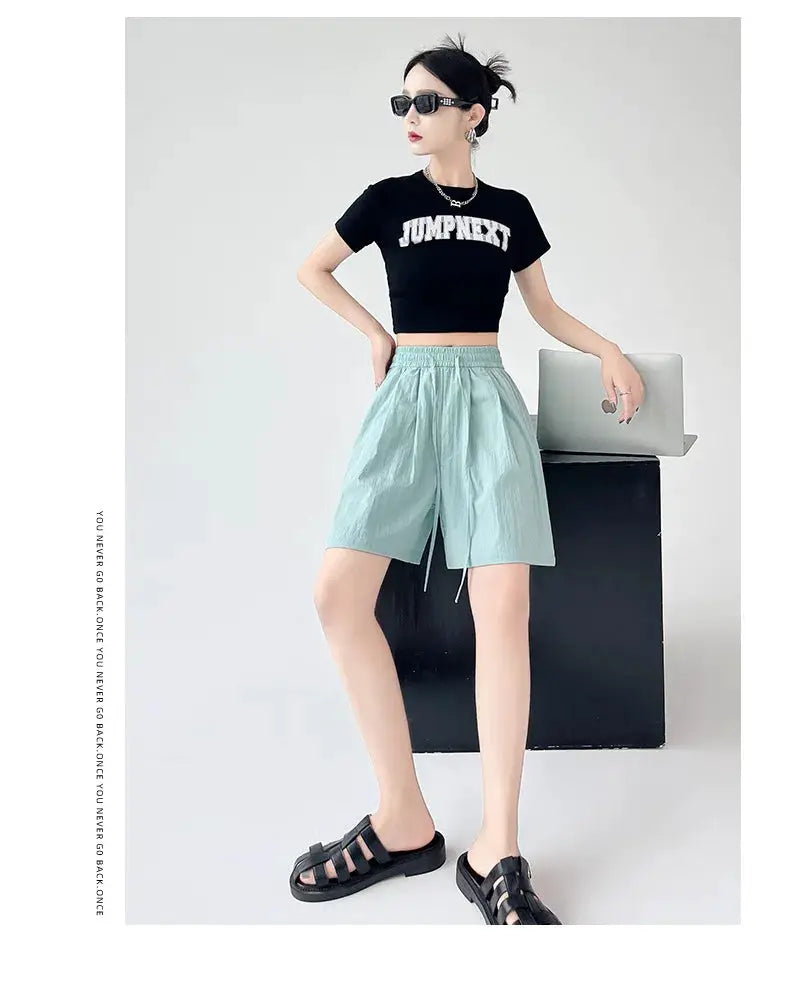 Women’s shorts with elastic high waist and two pockets in light blue, loose beach style