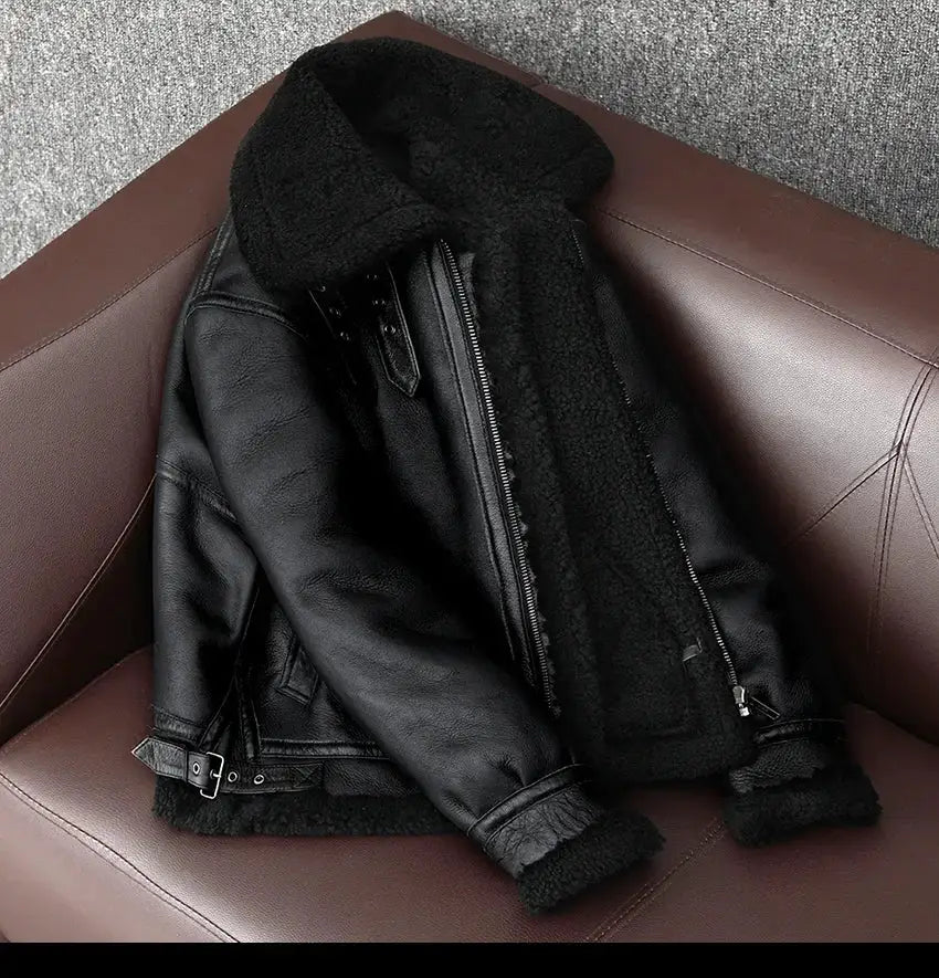 Men's black leather shearling jacket with zip front and waist belt, plush wool lining