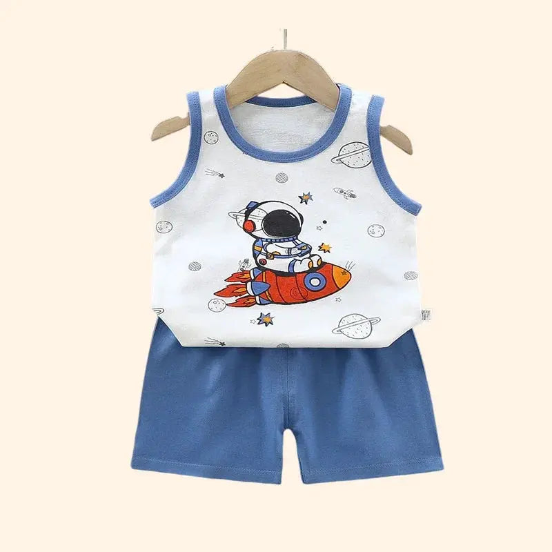 2-piece kids vest set from Simples Market: white sleeveless top with rocket print and blue trim + blue shorts.