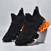 Men's black knit sneakers by Simples Market with orange bubble sole.