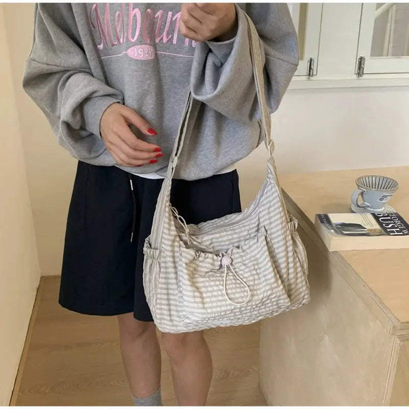 Nylon shoulder bag by Simples Market, beige striped fabric, crossbody with drawstring front pocket