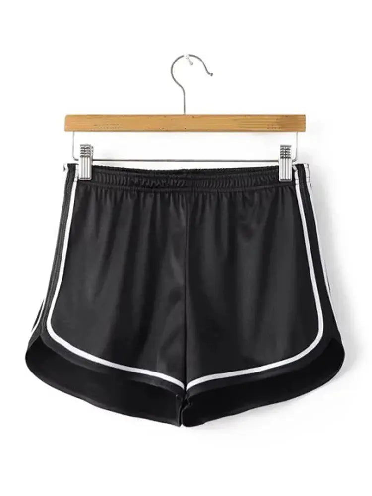 Women's black silk shorts with white piping and elastic waistband
