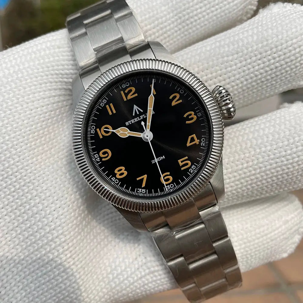 Steelflier SF741 quartz wristwatch with black dial, gold numerals, stainless steel bracelet