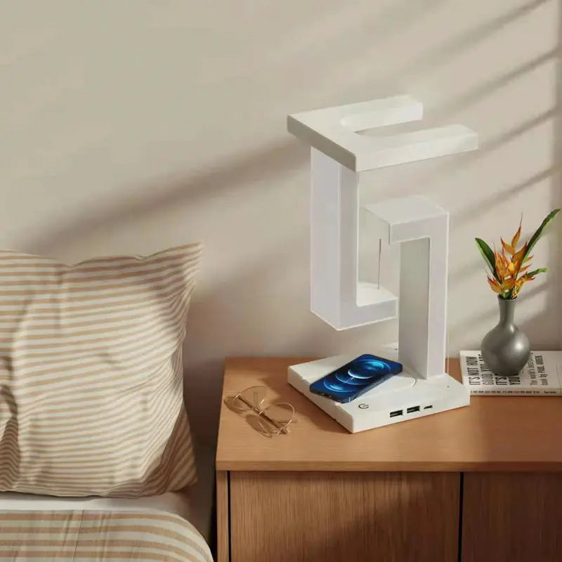 Floating white lamp with 10W wireless charger on a nightstand; modern decorative light for bedroom/office