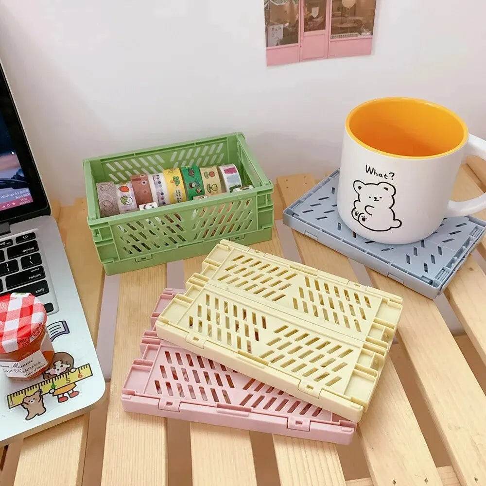 Simples Market folding plastic storage baskets set of four in green, yellow, pink and blue for desktop organization.