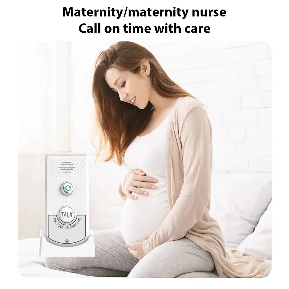 Silver H8-2T wireless intercom unit with TALK button beside a pregnant woman on a bed
