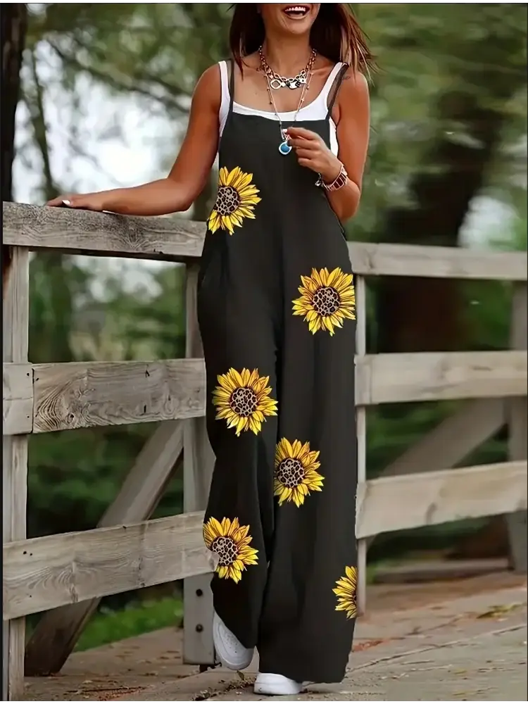 Simples Market women's sleeveless jumpsuit with suspenders; black fabric with bold sunflower prints for casual summer wear
