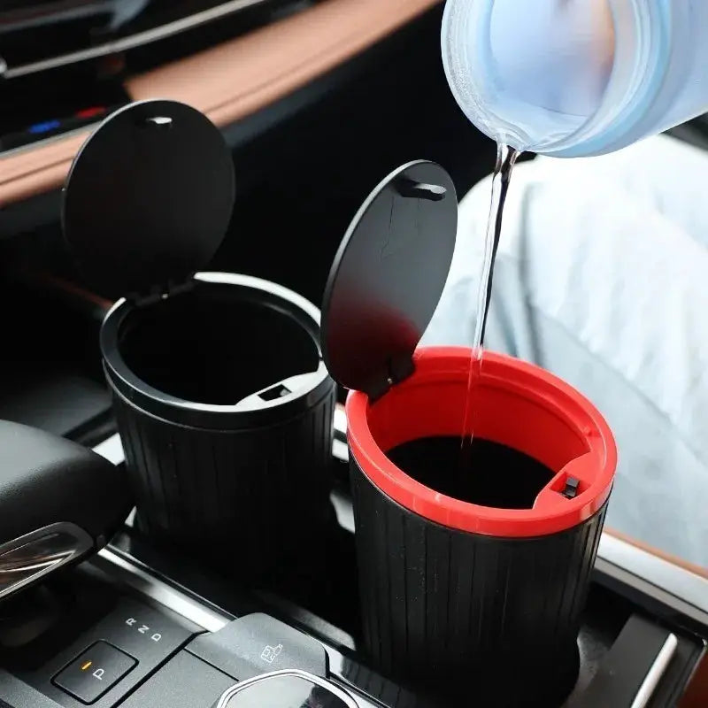 Universal car trash bin 2-piece set, black with red inner rim, fits car cup holders.