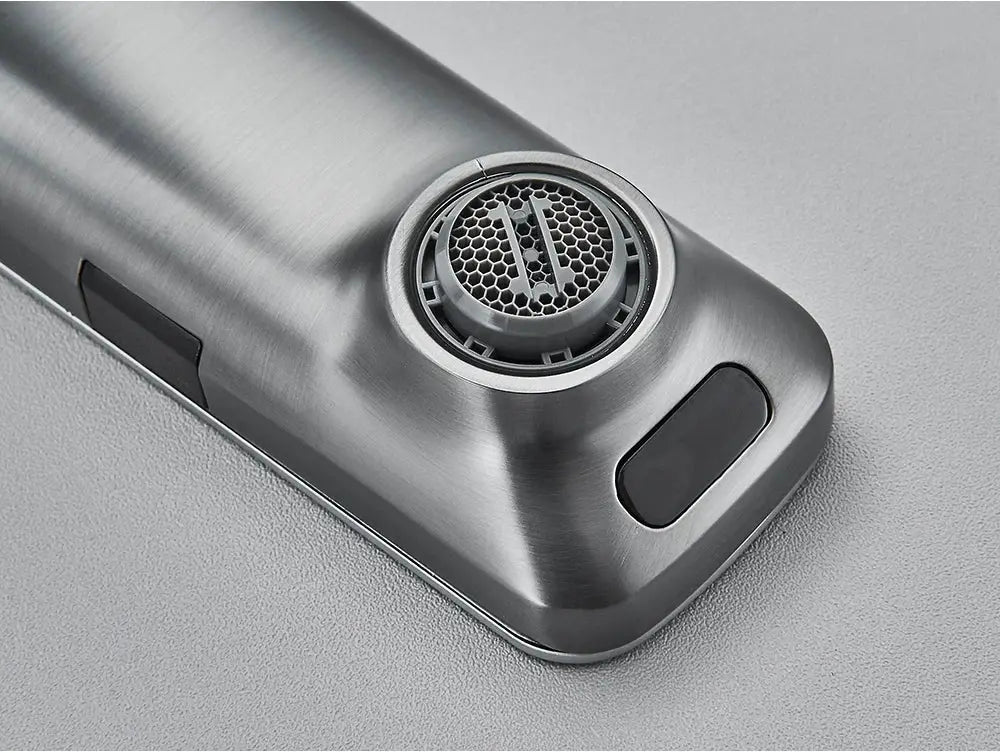 Smart sensor basin faucet base in stainless steel finish with circular sensor grill and two black touch panels.