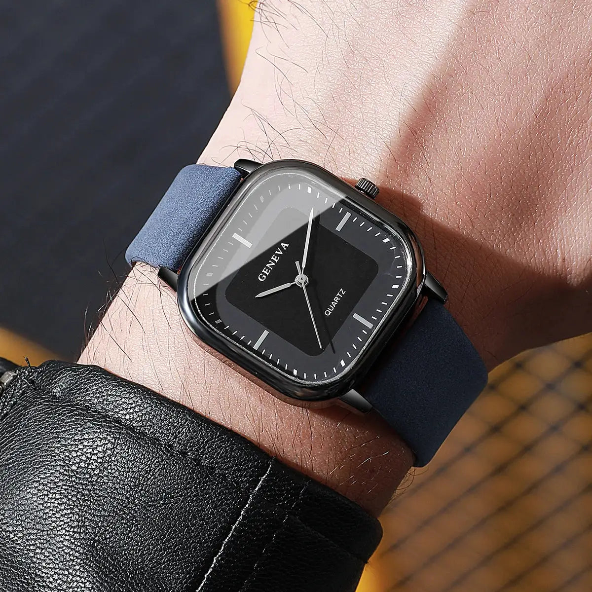 Men's square-dial quartz watch with Geneva logo, minimalist black dial, blue leather strap.