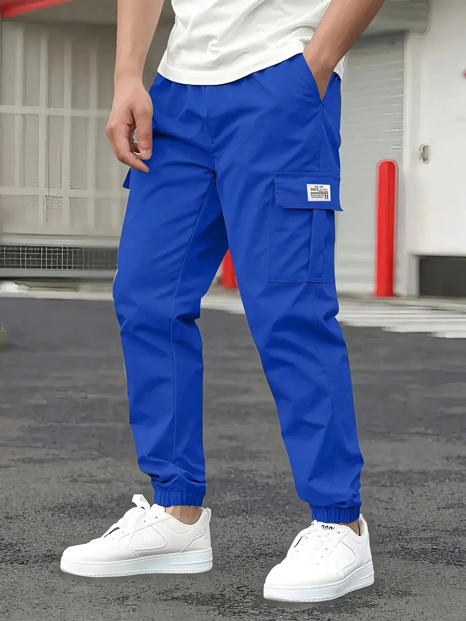 Men's blue cargo pants with thigh and side pockets for outdoor workwear