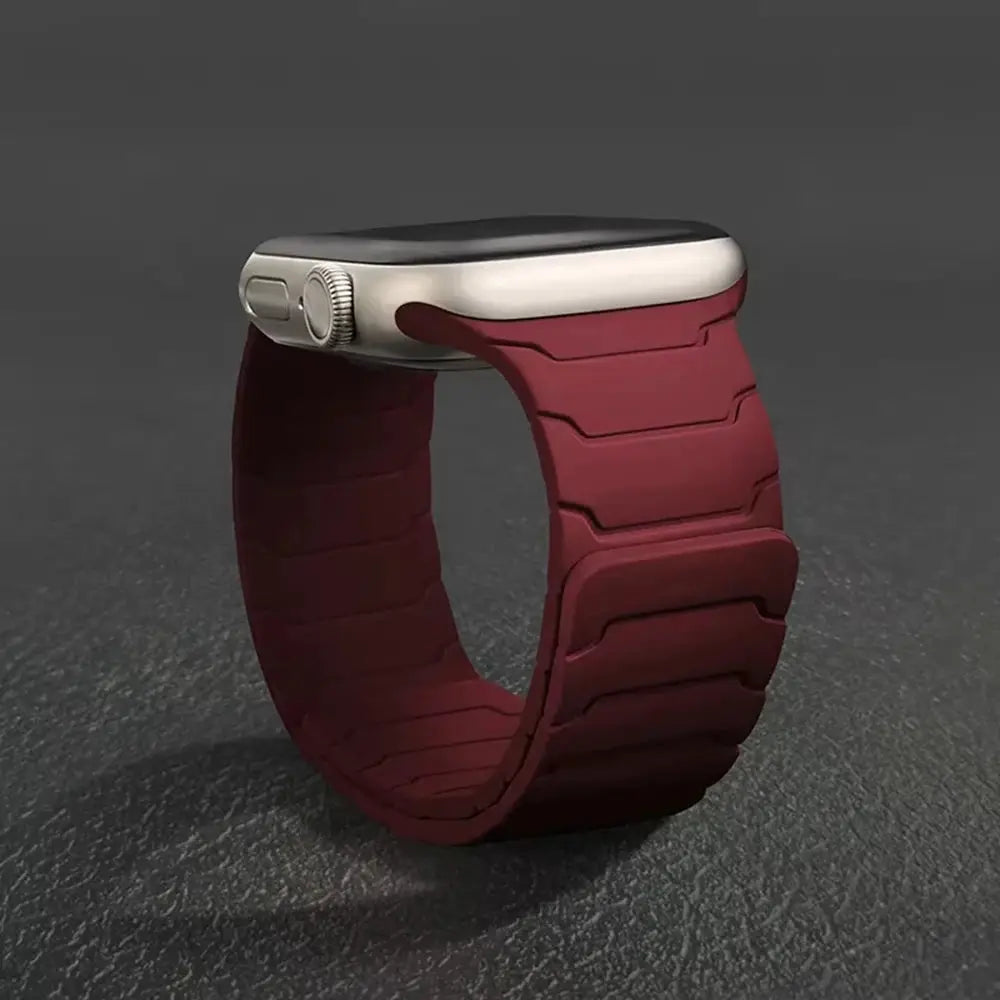 Silicone magnetic strap for Apple Watch in burgundy; fits 40-49mm sizes.