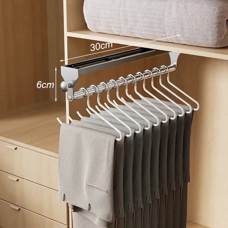 Pull-out trouser hanger rack with many white non-slip hangers for space-saving wardrobe storage