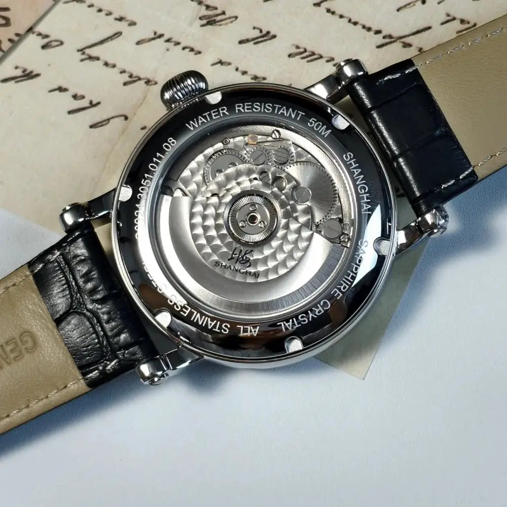 Shanghai 42mm automatic watch with sapphire crystal, leather strap and stainless steel case; visible movement.