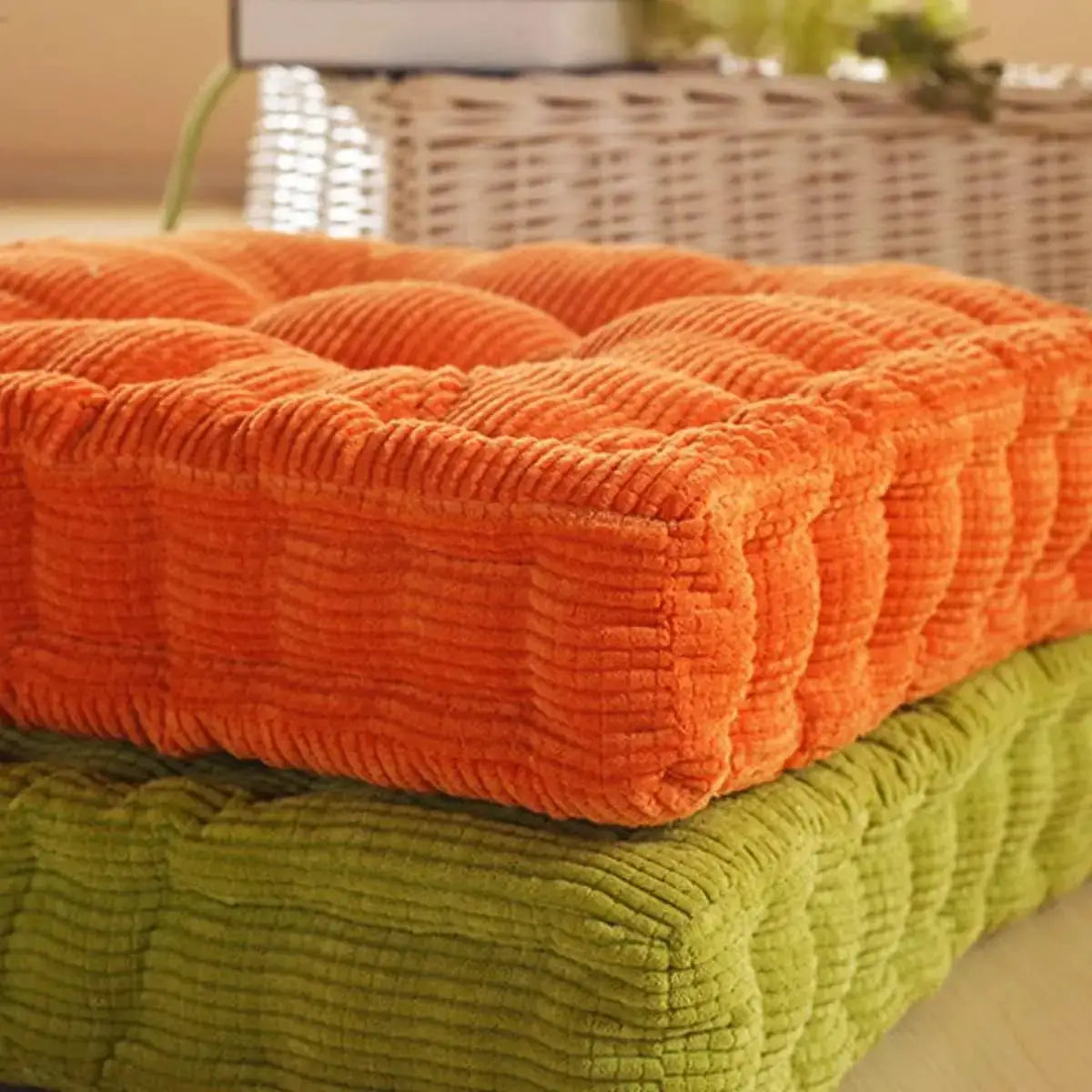 Two tufted seat cushions, orange and green, 50x50cm, thick plush fabric.