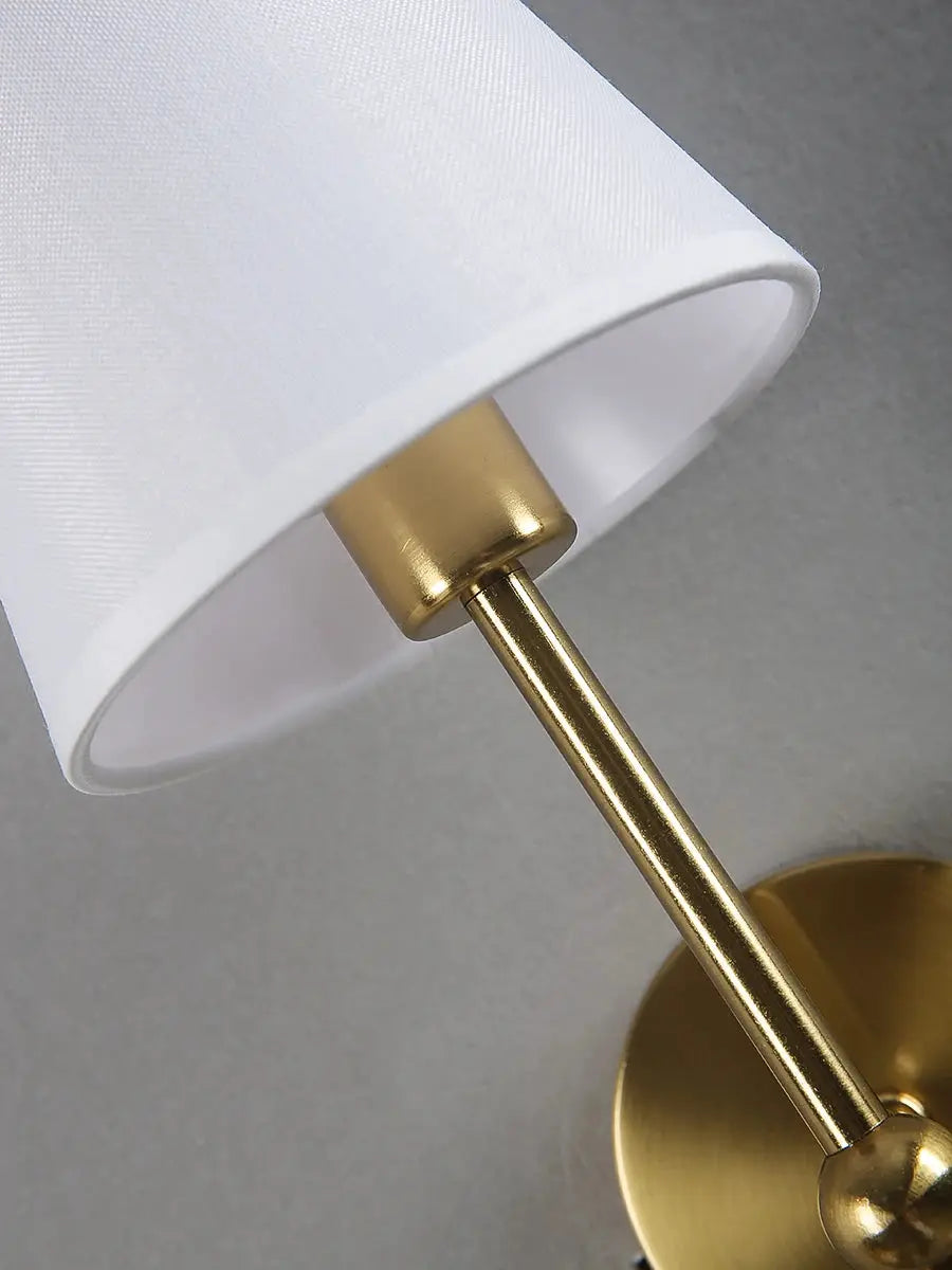 American Retro brass wall lamp by Simples Market with white fabric shade.