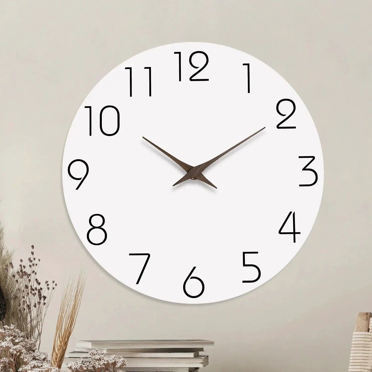 Casual modern white wooden wall clock with large black numerals and brown hands.