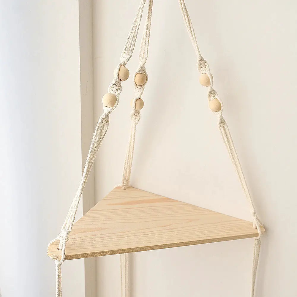 1-tier triangular wooden wall shelf hanging by cotton ropes with beads; natural finish, boho decor