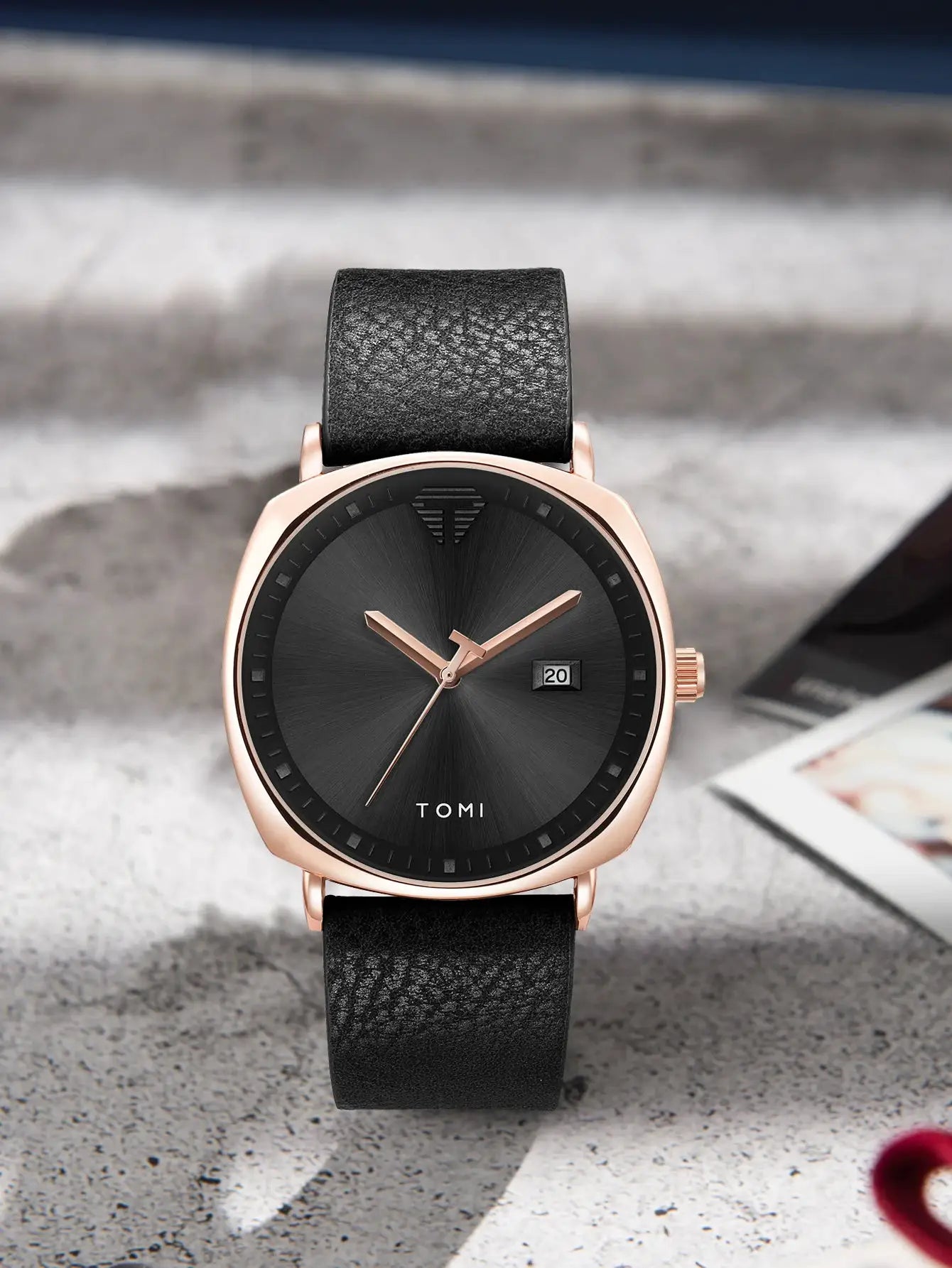 TOMI men's minimalist watch with rose-gold case and black leather strap.