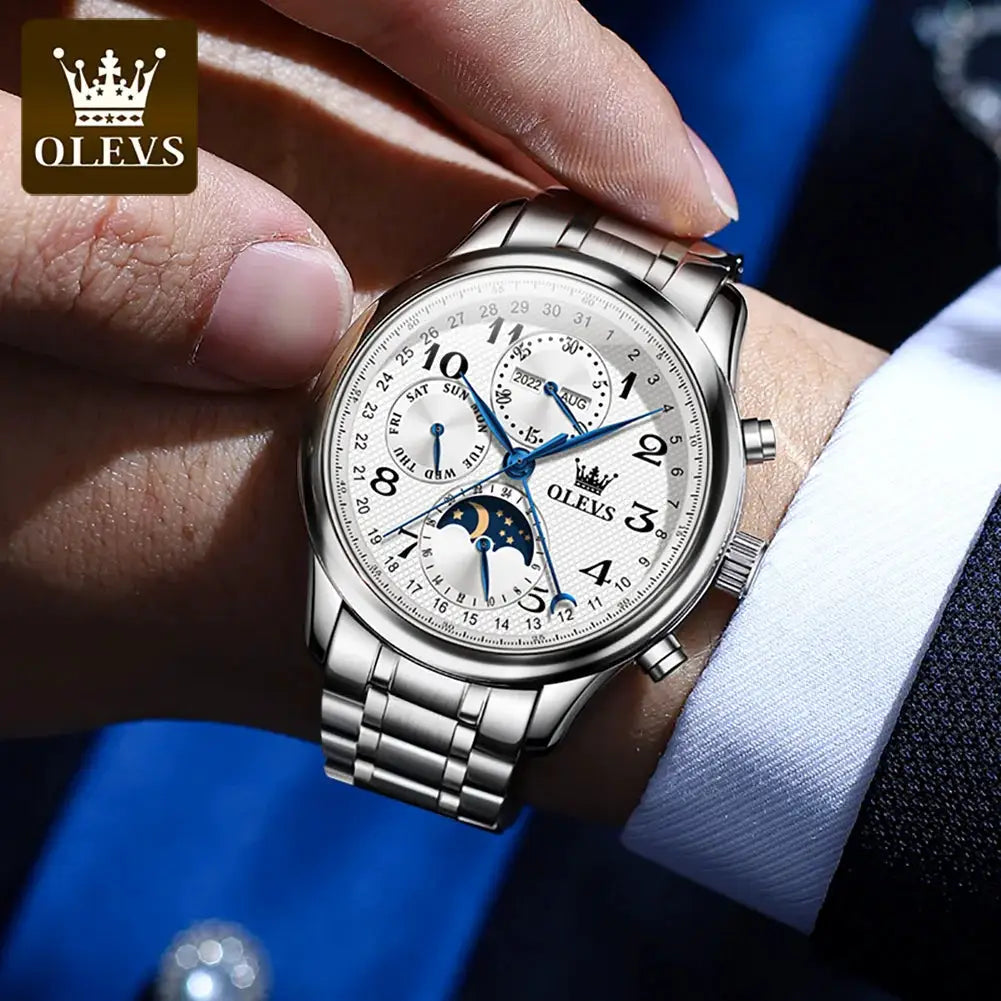 OLEVS 6667 men's luxury automatic mechanical watch with moonphase on a silver stainless steel bracelet.