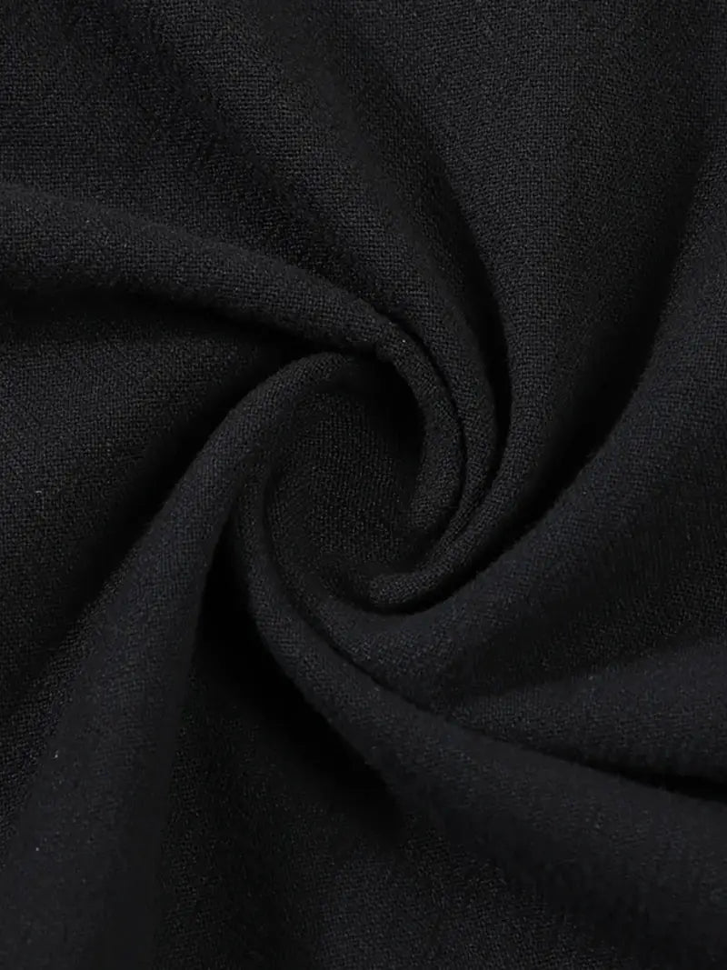 Men's black linen shirt, close-up of breathable fabric texture.
