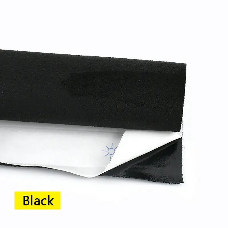 Black self-adhesive faux suede fabric sample with exposed adhesive backing