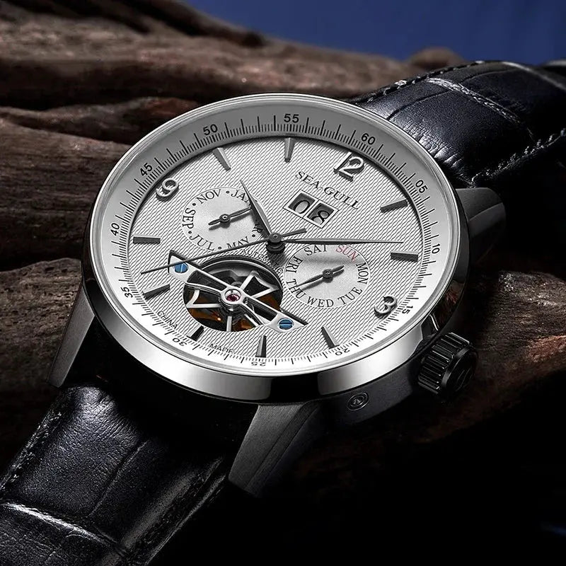 Seagull men’s automatic watch with silver dial, visible flywheel skeleton, and black leather strap.