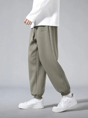 Men's cotton-polyester jogger pants in olive, baggy hip-hop style with drawstring and cuffed ankles