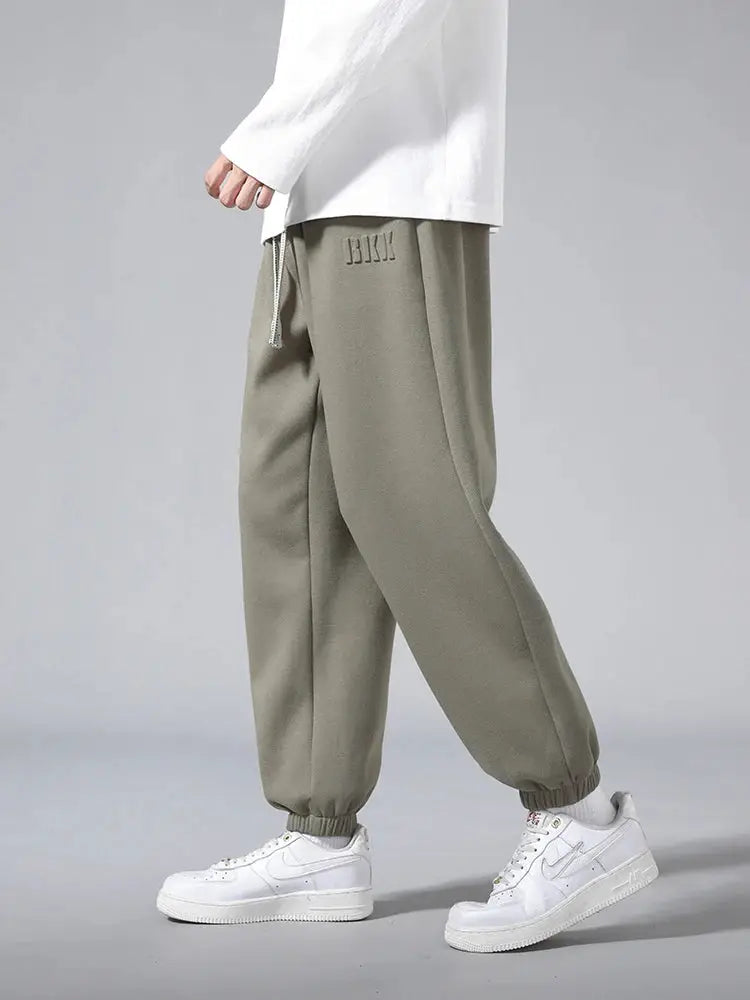 Men's cotton-polyester jogger pants in olive, baggy hip-hop style with drawstring and cuffed ankles