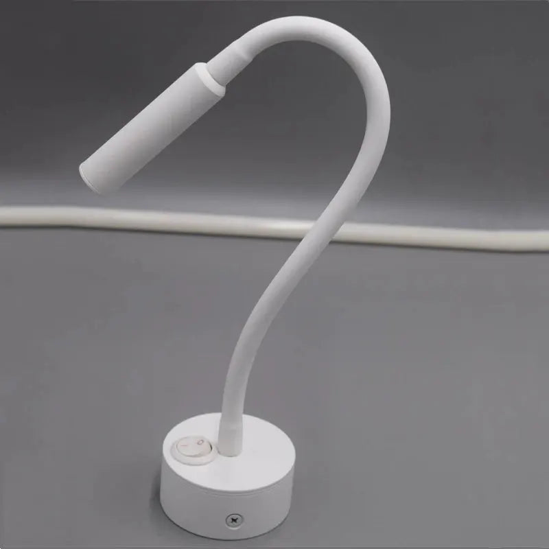 LED flexible hose wall lamp by Simples Market with white gooseneck, round base and switch