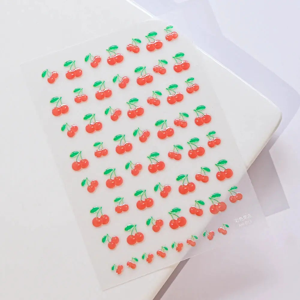 Cherry nail art decals sheet with multiple small red cherries and green leaves for summer manicure