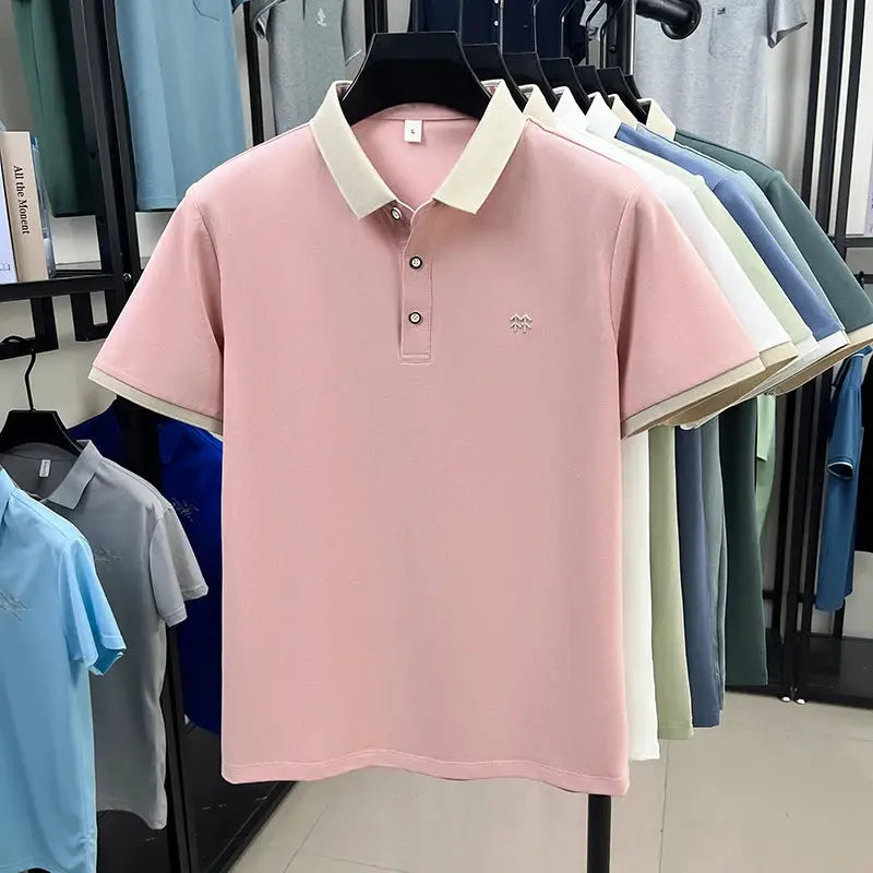 Men's pink silk-cotton short-sleeve polo shirt by Simples Market with cream collar and cuffs, small chest embroidery.
