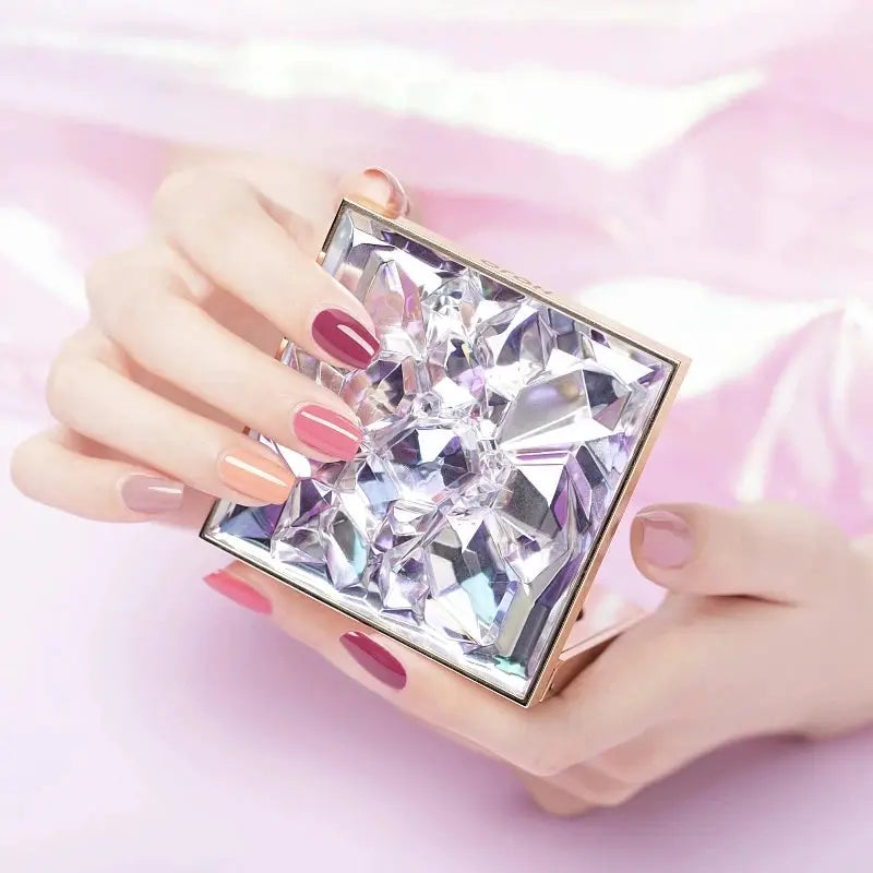 Gel nail polish kit by Simples Market with pastel swatches and a faceted crystal case